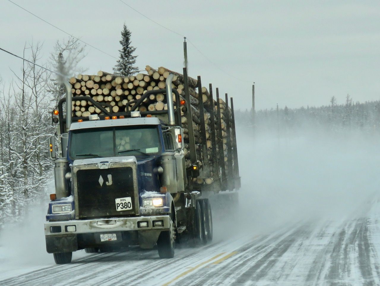 Premium AI Image | A Photo of a Durable Logging Truck Carrying Timber Premium AI Image | A Photo of a Durable Logging Truck Carrying Timber